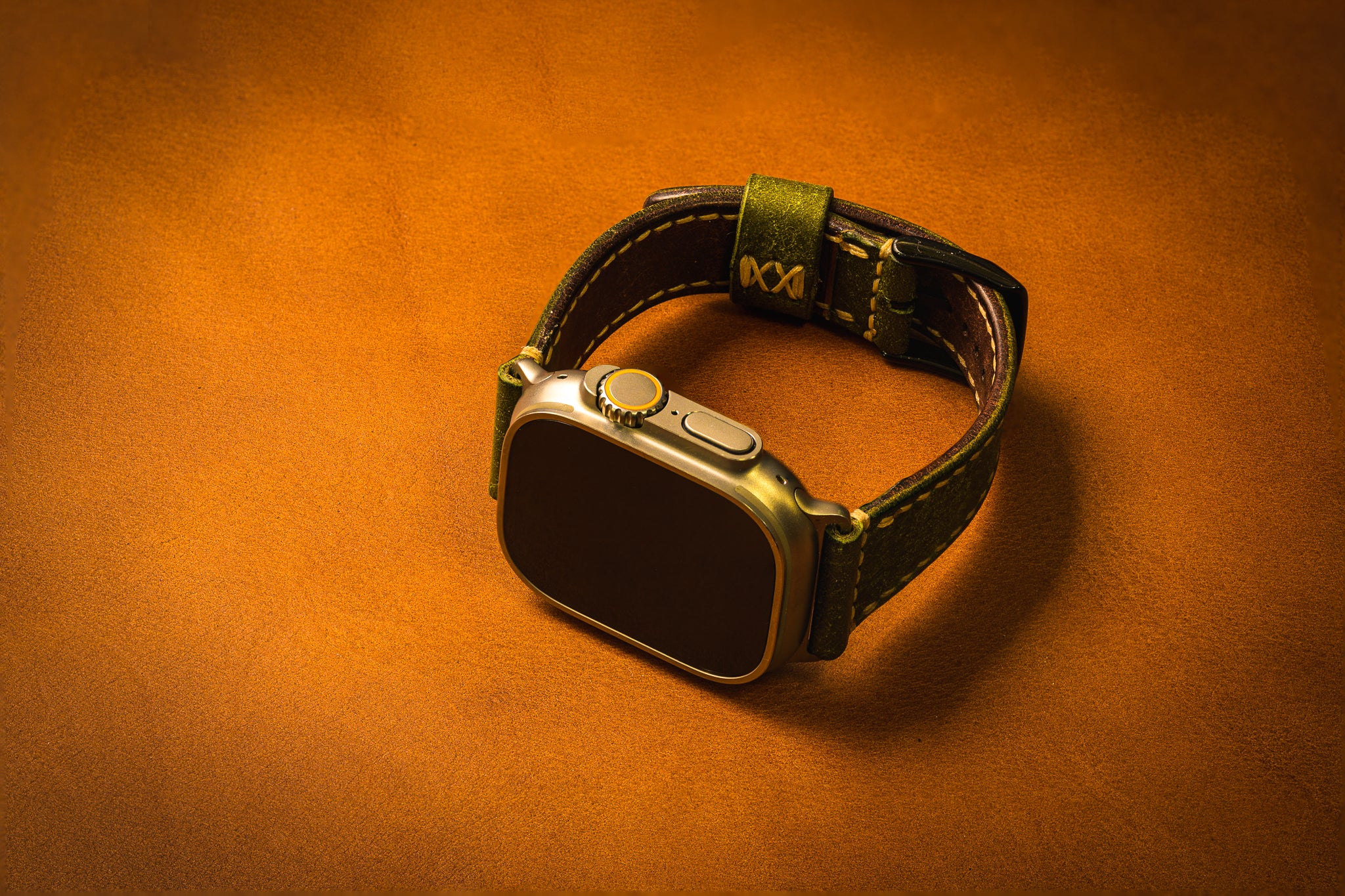 Smartwatch with a leather strap on an brown background